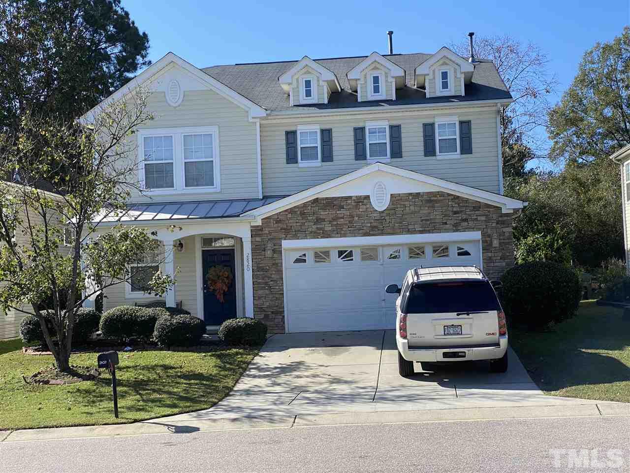 2820 Roundleaf Court Raleigh, NC 27604 - Photo 1 of 4 a car parked in front of a brick house