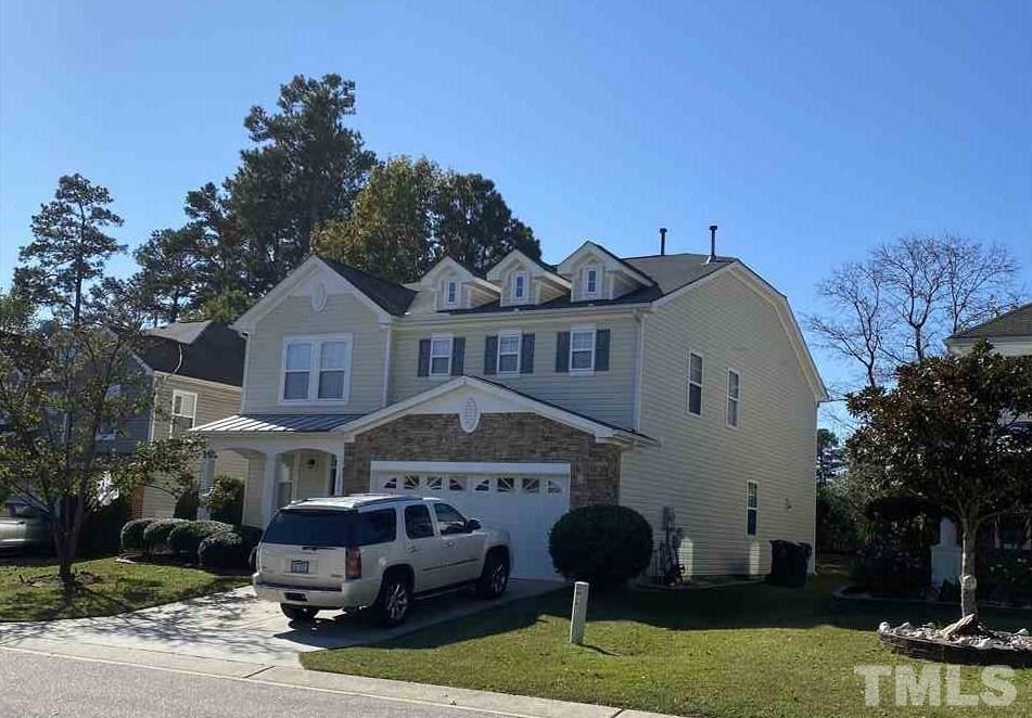 2820 Roundleaf Court Raleigh, NC 27604 - Photo 2 of 4 a front view of a house with garden