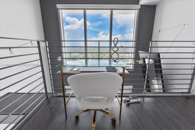 a view of a balcony with table and chairs
