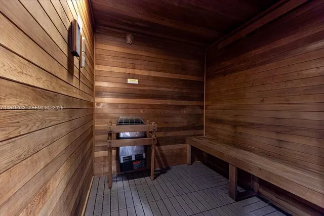 a bathroom with a shower and a sink