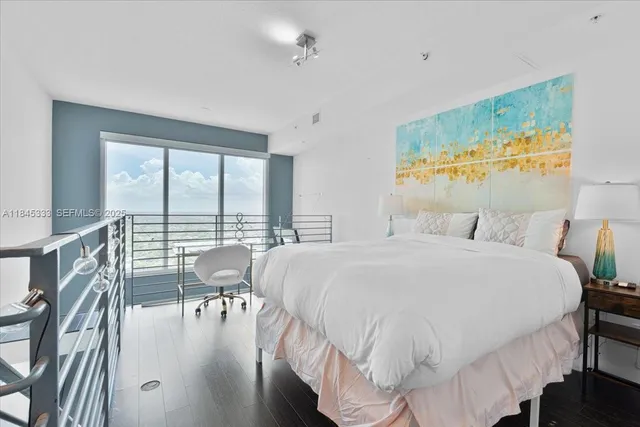 a large white bed in a white room