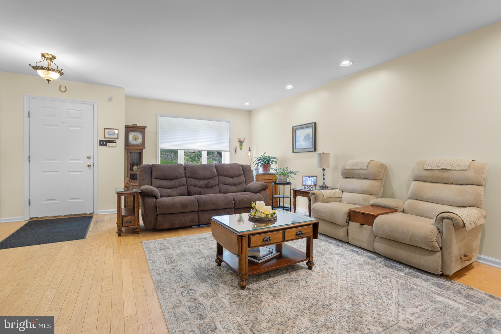 326 Westbriar Drive Media, PA 19063 - Photo 5 of 29 a living room with furniture a lamp and a rug