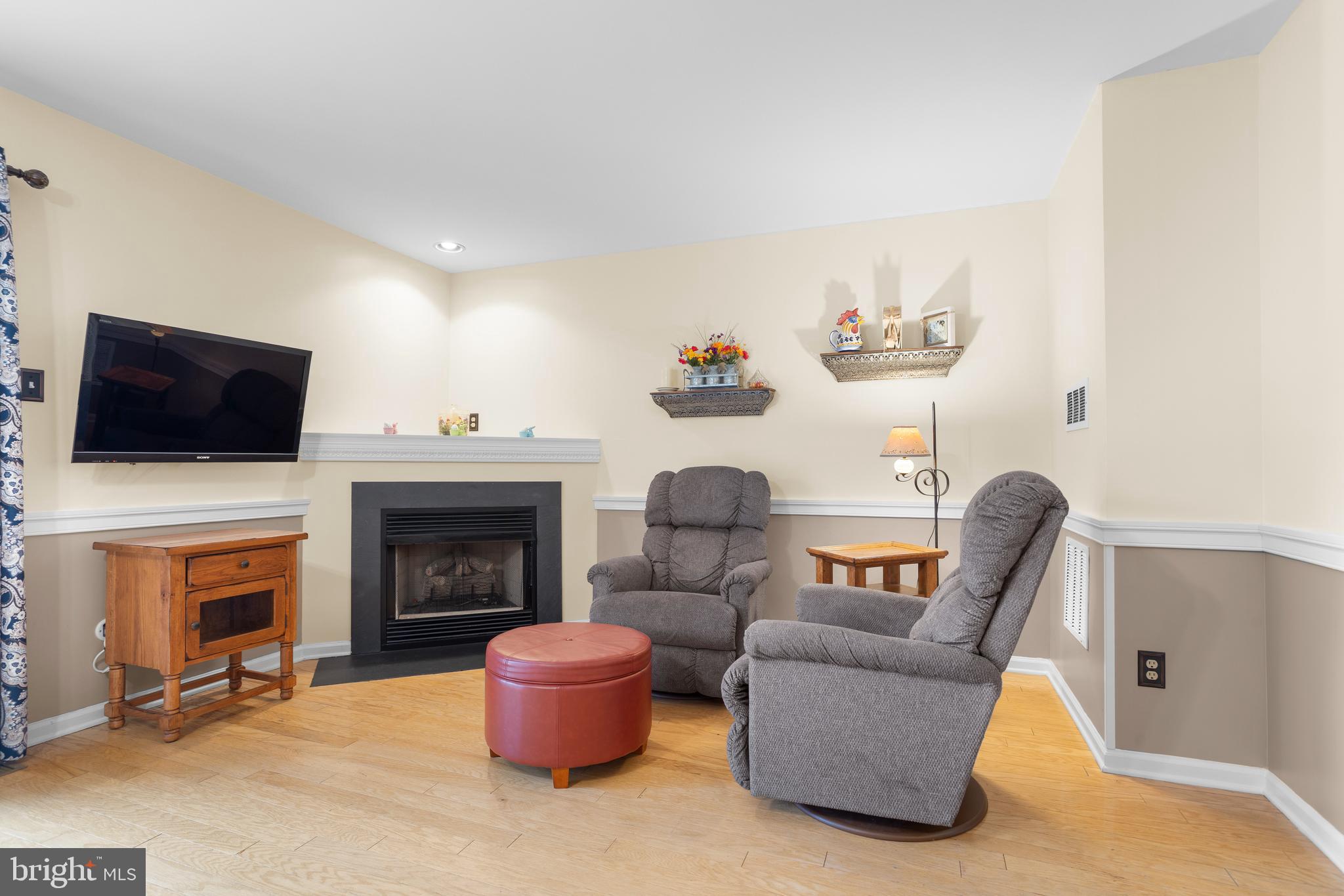 326 Westbriar Drive Media, PA 19063 - Photo 9 of 29 a living room with furniture a fireplace and a flat screen tv