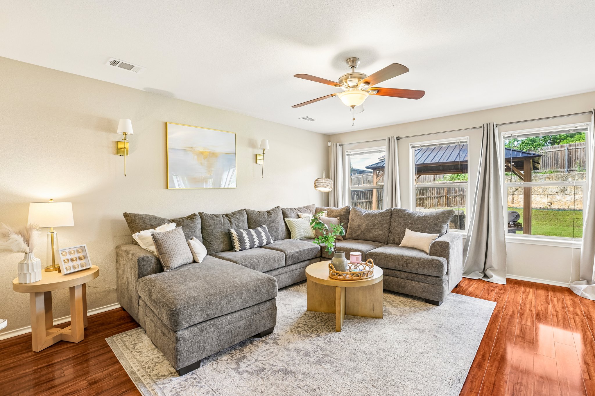 5508 Emma Thompson Way Austin, TX 78747 - Photo 9 of 34 The living room is light and bright, featuring beautiful wood floors and an inviting space to relax or gather with guests.