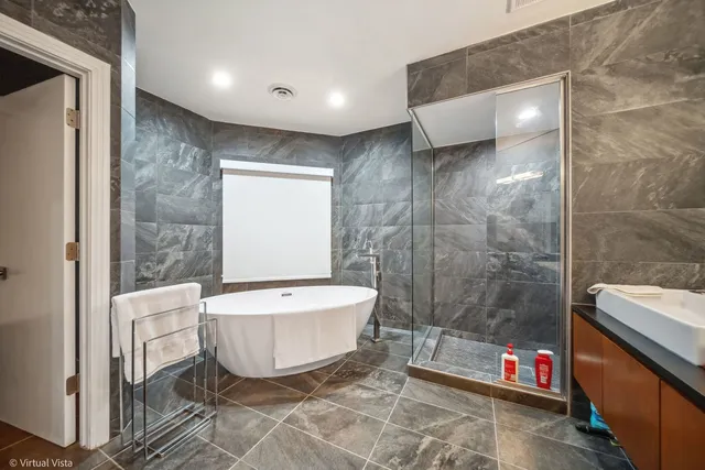 a bathroom with a tub and sink