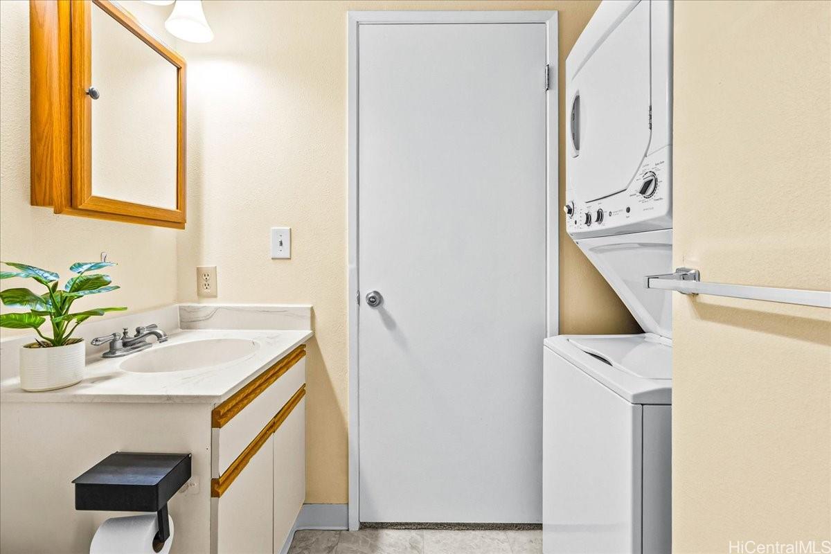 92-1019 Alaa Street, Unit 16203 Kapolei, HI 96707 - Photo 15 of 25 a bathroom with a sink and a mirror