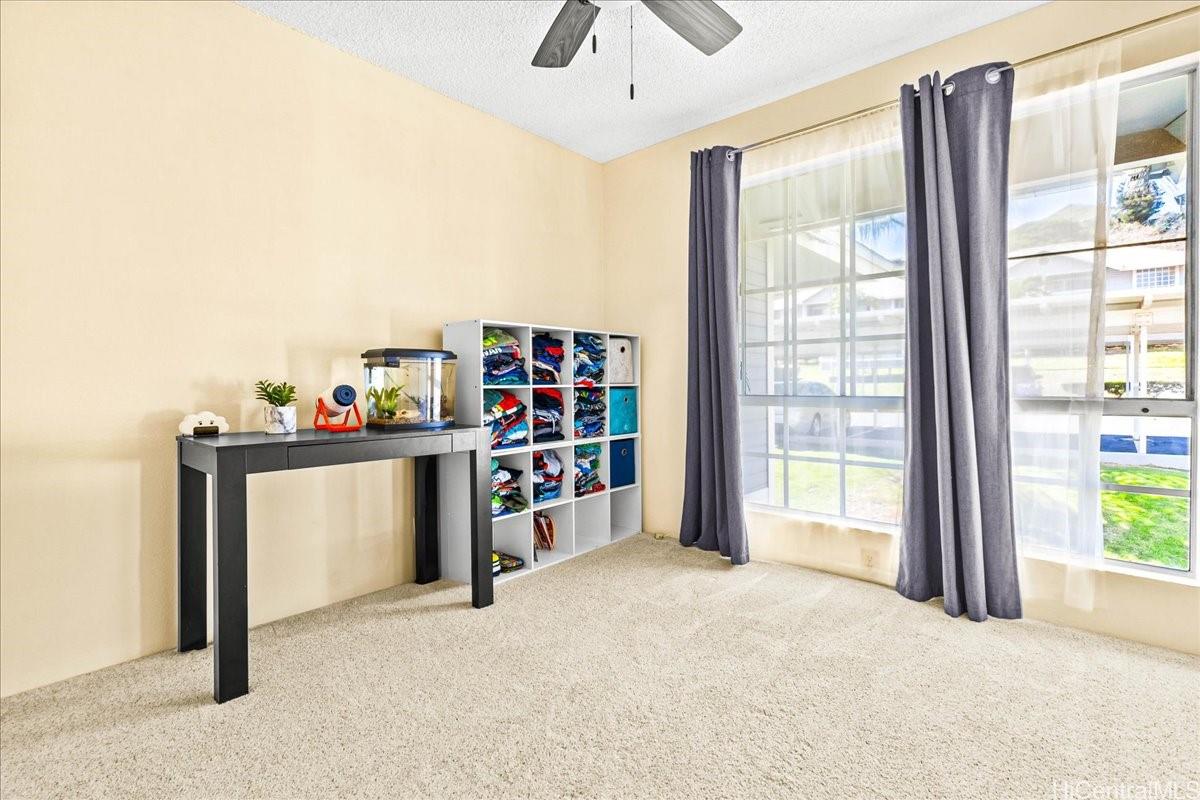 92-1019 Alaa Street, Unit 16203 Kapolei, HI 96707 - Photo 18 of 25 a view of an empty room with a window and storage area