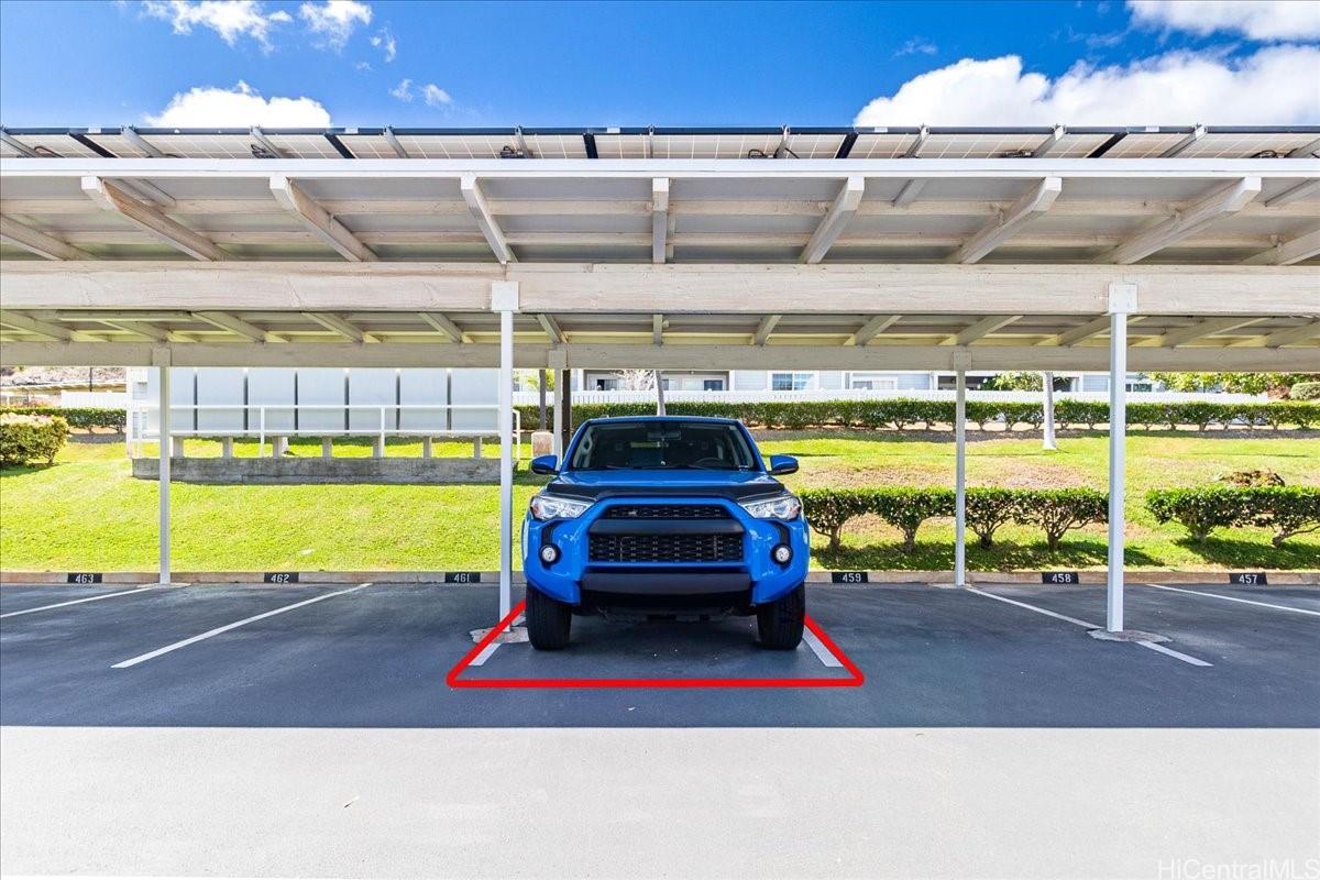 92-1019 Alaa Street, Unit 16203 Kapolei, HI 96707 - Photo 22 of 25 a view of a swimming pool with a yard and potted plants