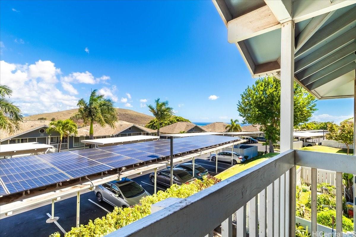92-1019 Alaa Street, Unit 16203 Kapolei, HI 96707 - Photo 25 of 25 a view of a balcony with wooden floor and outdoor space
