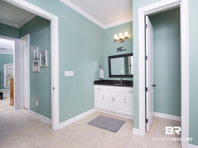 7814 Balin Drive Daphne, AL 36527 - Photo 14 of 26 This bathroom features his and her vanities, separate tub and shower, as well as plenty of storage.