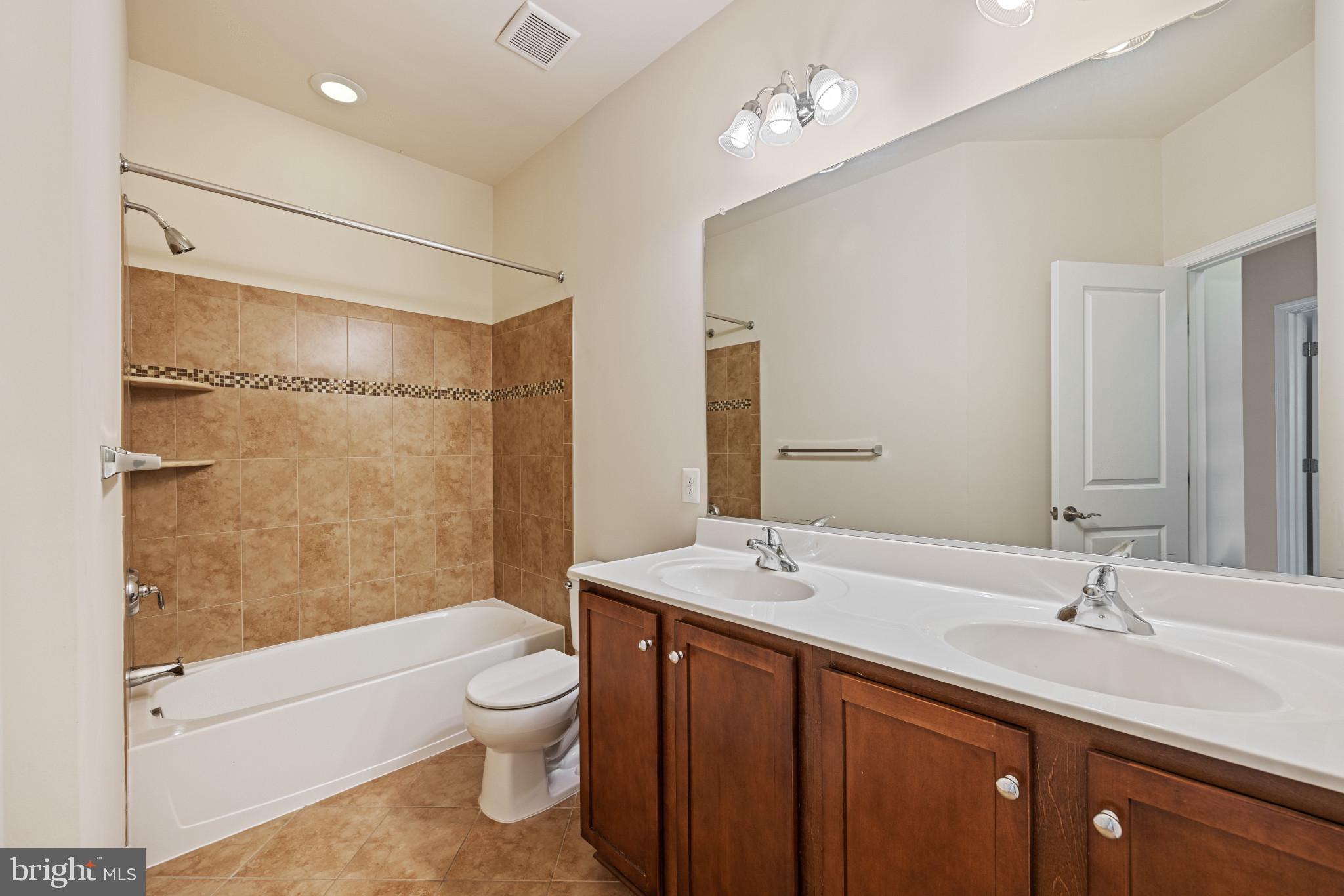 6126 Edward Hill Road Ellicott City, MD 21043 - Photo 34 of 64 Upper Level Hall Bath w/Dual Vanities & Ceramic Ti