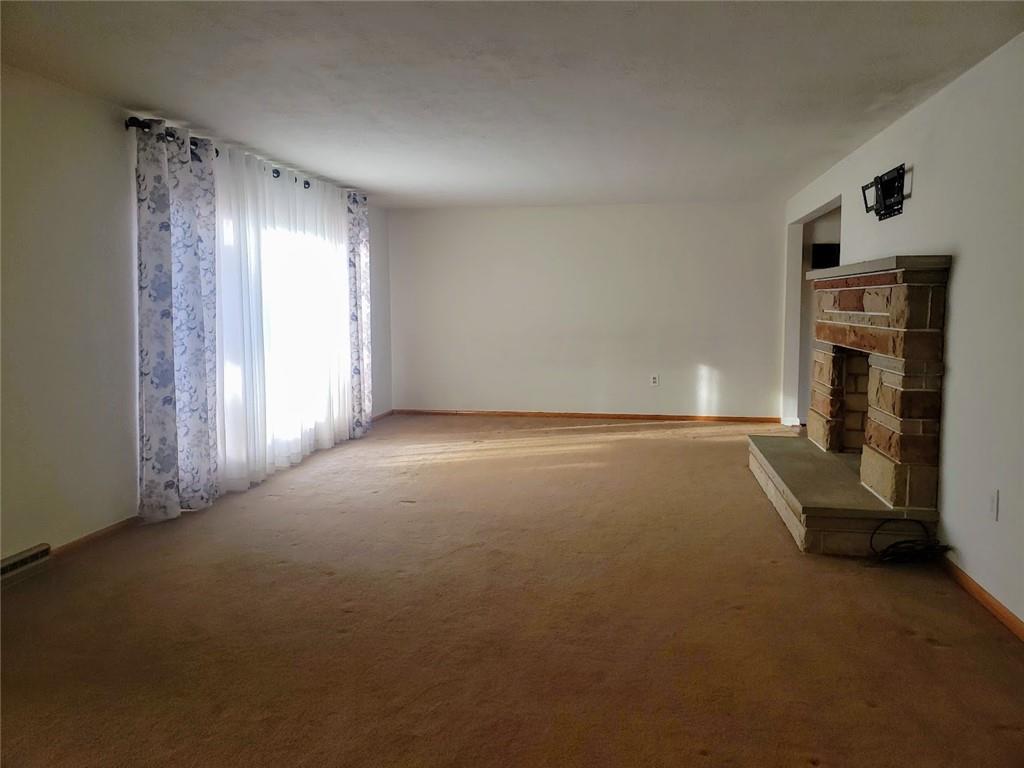 161 North Benbrook Road Butler, PA 16001 - Photo 3 of 25 a view of empty room with fireplace and window