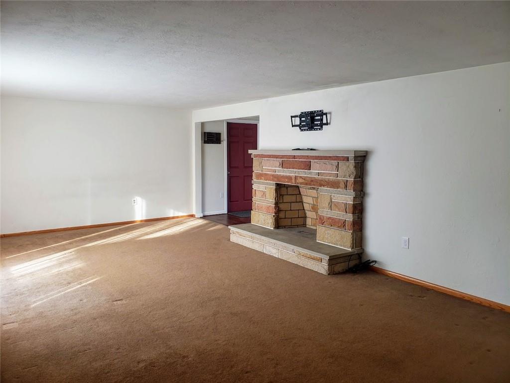 161 North Benbrook Road Butler, PA 16001 - Photo 4 of 25 a view of an empty room with a fireplace