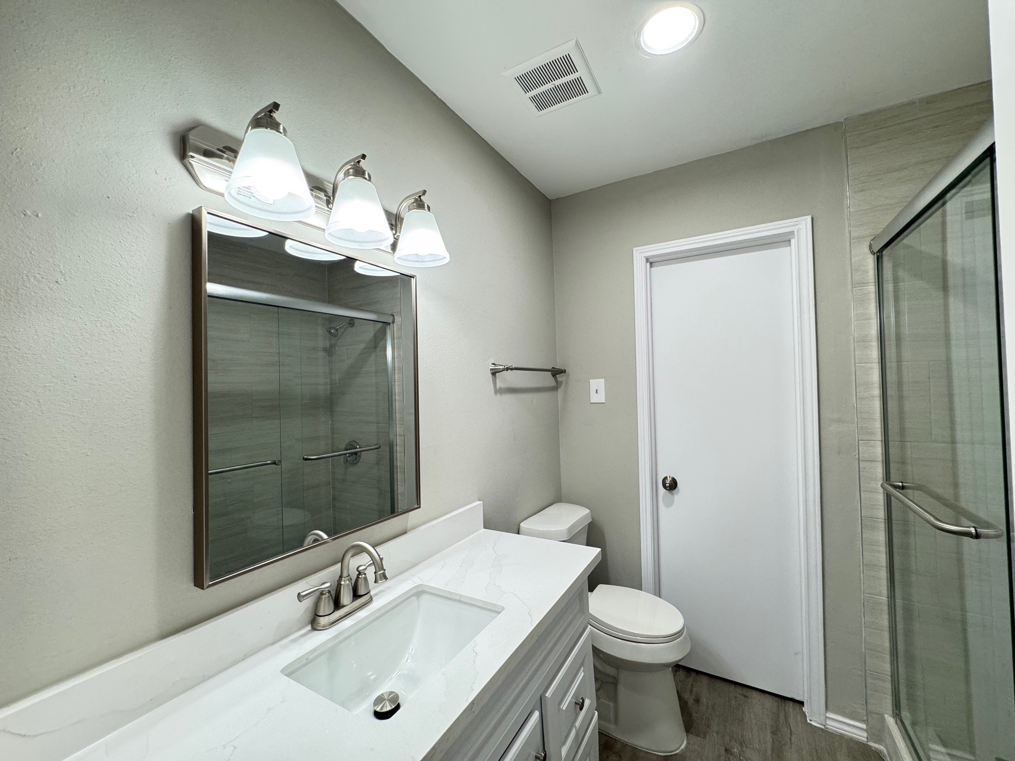 9114 Kempwood Drive, Unit 9114 Houston, TX 77080 - Photo 12 of 16 a bathroom with a sink toilet and shower
