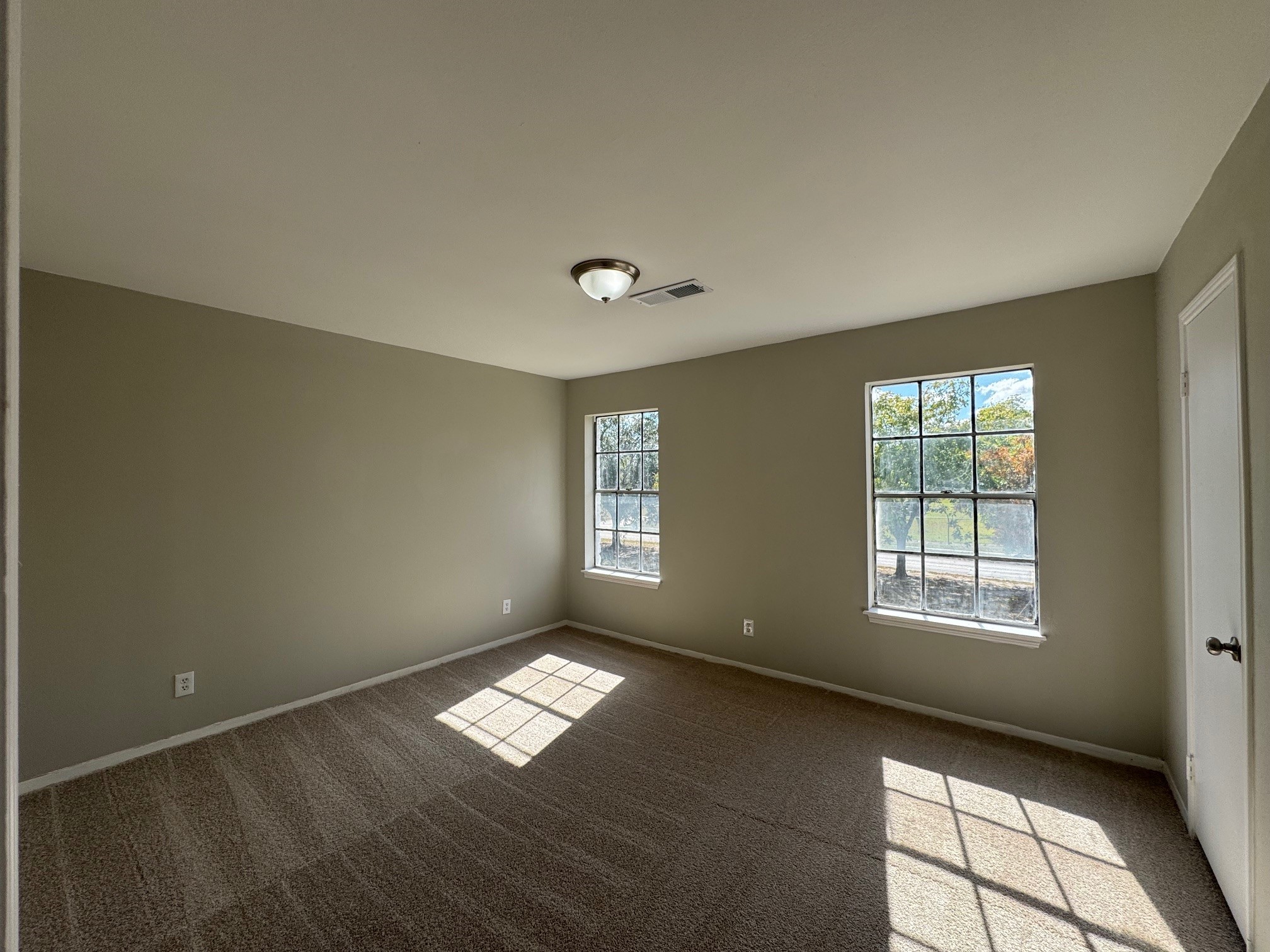 9114 Kempwood Drive, Unit 9114 Houston, TX 77080 - Photo 13 of 16 a view of an empty room with a window