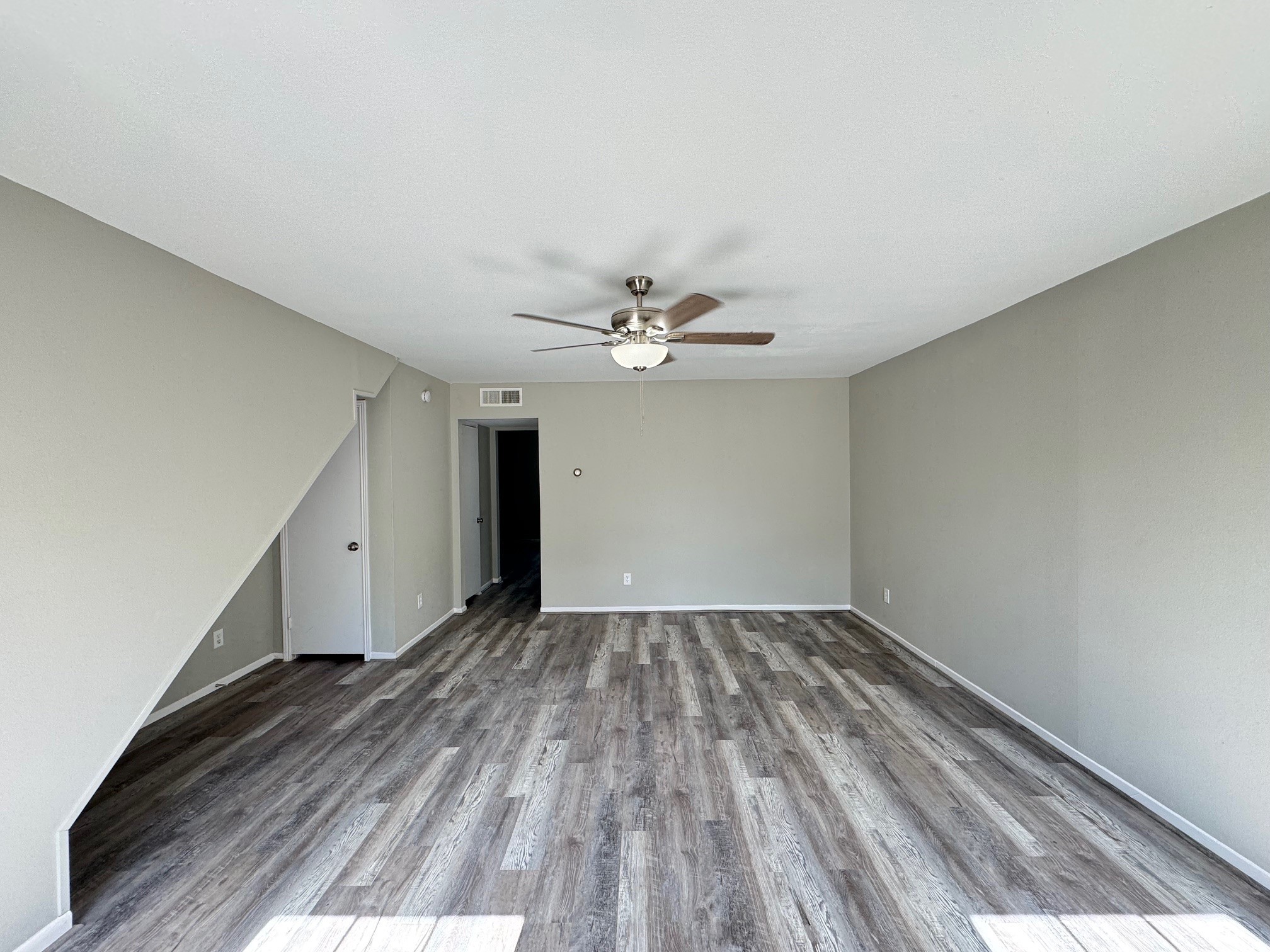 9114 Kempwood Drive, Unit 9114 Houston, TX 77080 - Photo 4 of 16 wooden floor in an empty room