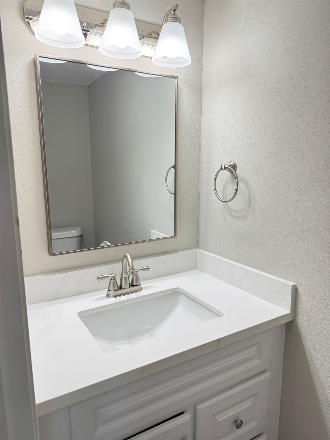 9114 Kempwood Drive, Unit 9114 Houston, TX 77080 - Photo 7 of 16 a bathroom with a sink and a mirror