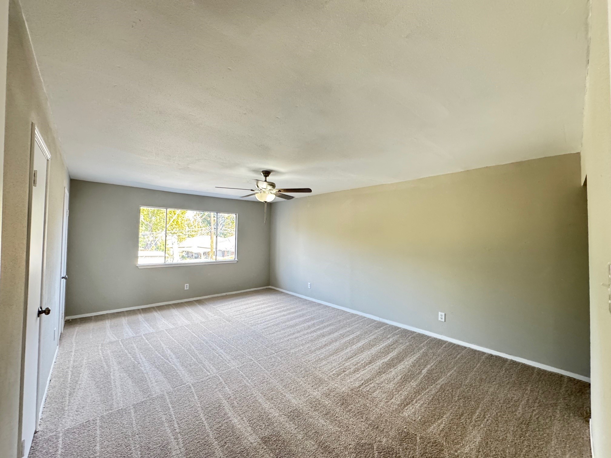 9114 Kempwood Drive, Unit 9114 Houston, TX 77080 - Photo 9 of 16 a view of empty room with windows