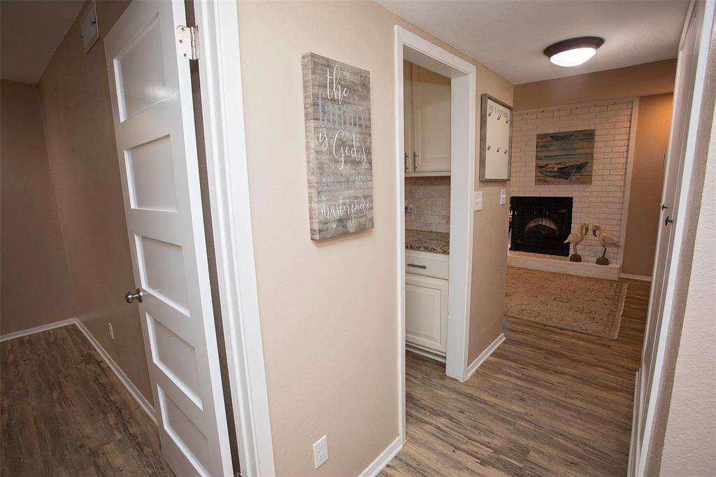 1361 Willow Beach Road, Unit A5 Graford, TX 76449 - Photo 8 of 17 a view of hallway with walk in closet and wooden floor