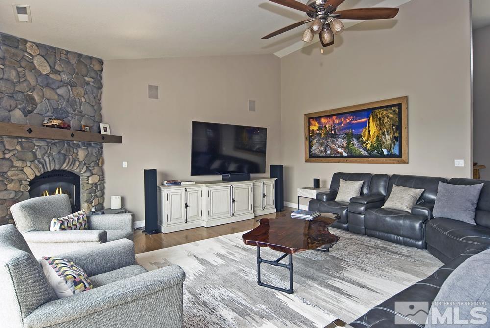 1540 East Valley Road Gardnerville, NV 89410 - Photo 19 of 40 a living room with furniture and a flat screen tv