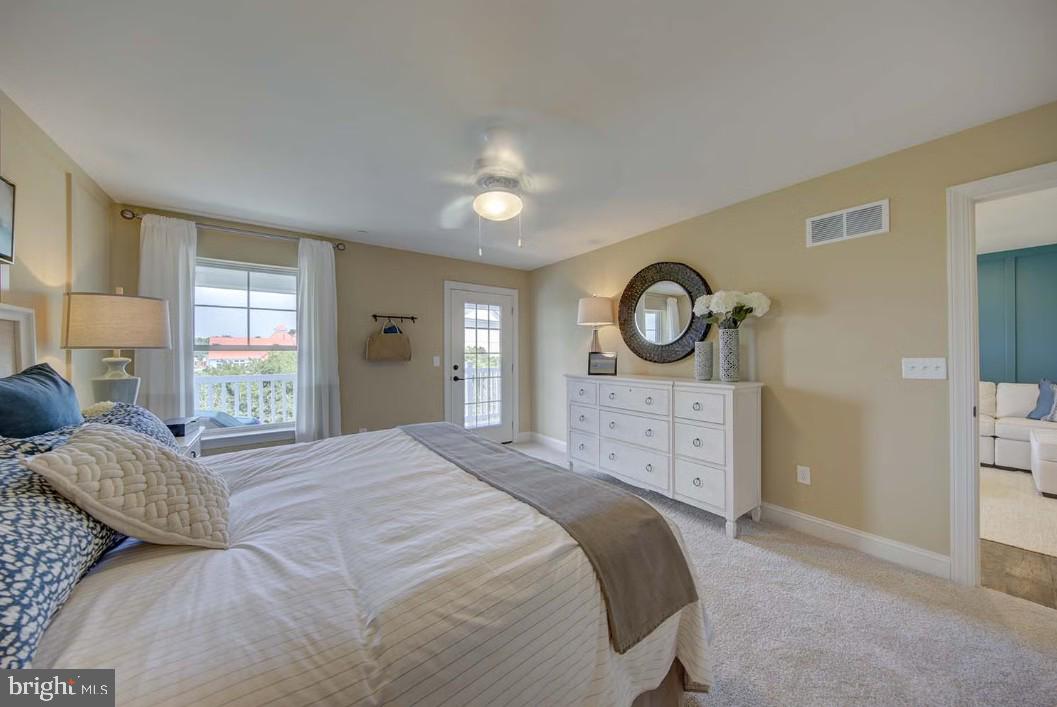401 Bering Road Ocean City, MD 21842 - Photo 16 of 74 a bedroom with a bed and a window