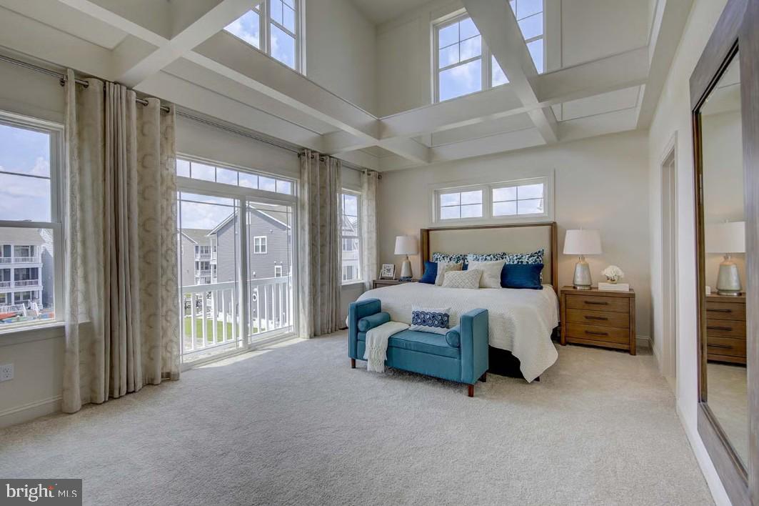 401 Bering Road Ocean City, MD 21842 - Photo 37 of 74 a spacious bedroom with a large bed and a large window