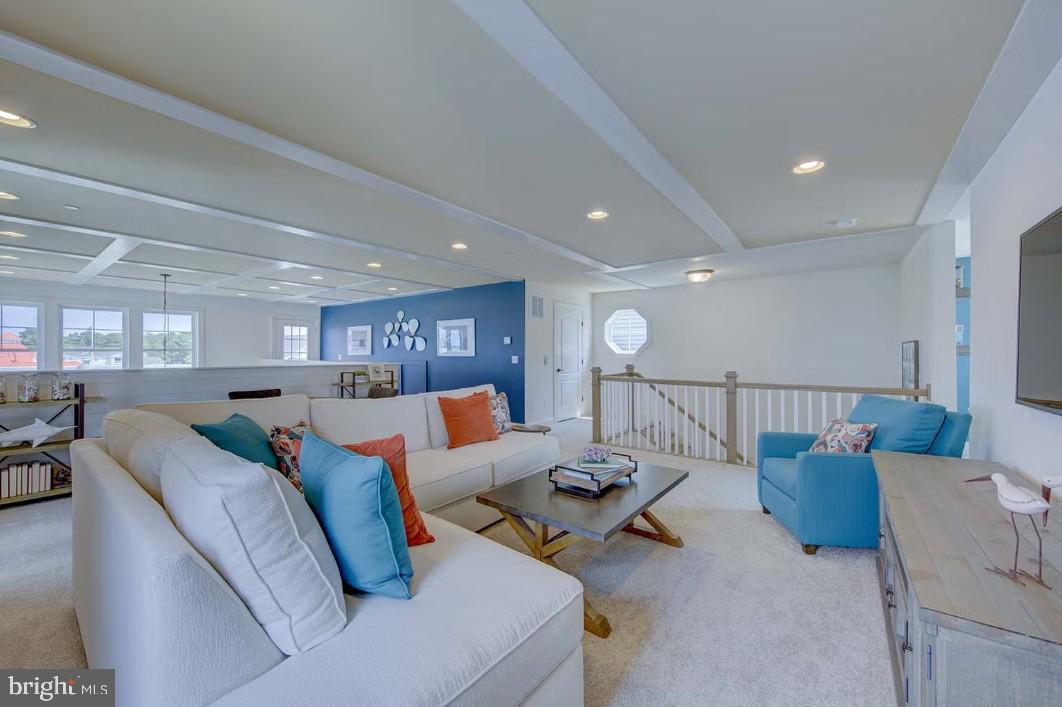 401 Bering Road Ocean City, MD 21842 - Photo 39 of 74 a living room with furniture and a table