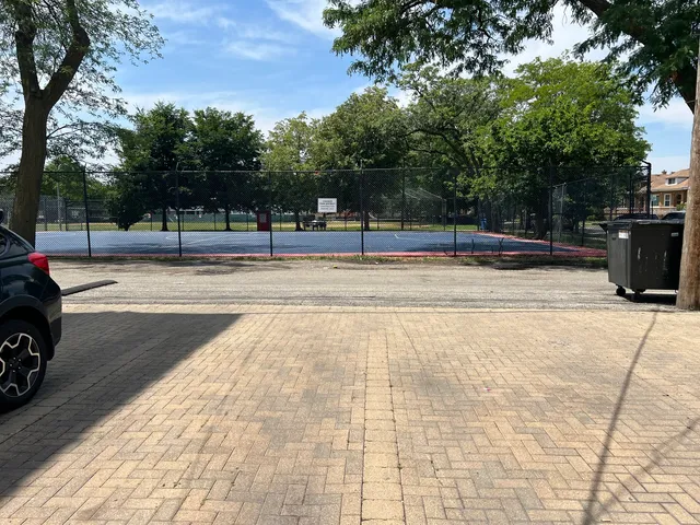 a view of a yard with basketball court