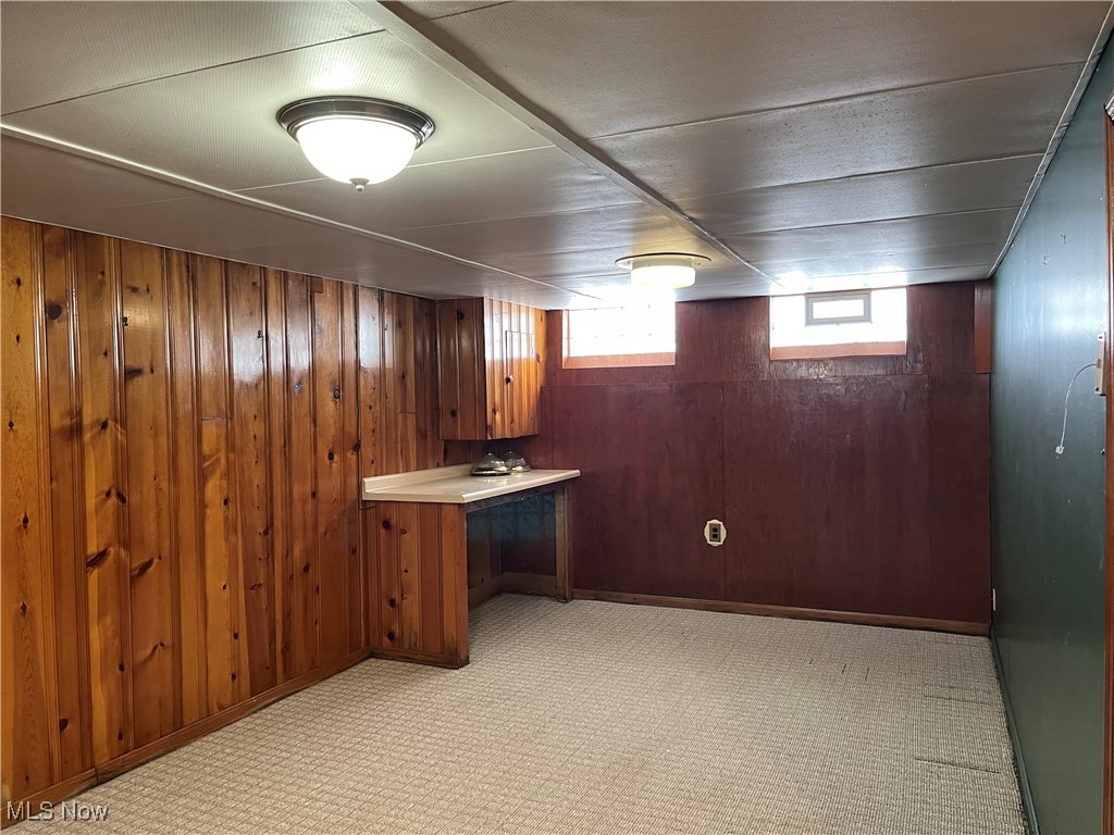 15405 Corkhill Road Maple Heights, OH 44137 - Photo 6 of 50 Carpeted Rec Room with knotty pine walls and glass block windows.