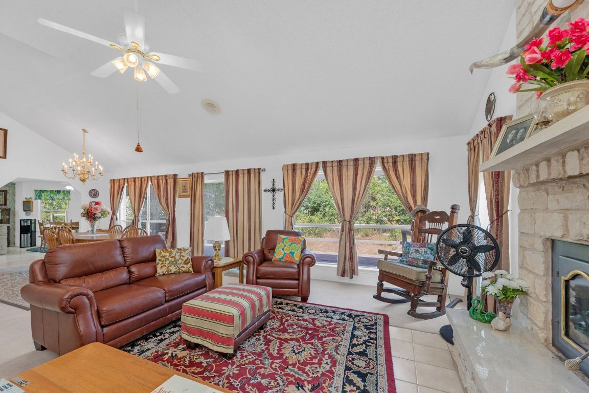 2105 Sam Bass Road Round Rock, TX 78681 - Photo 11 of 40 a living room with furniture fireplace and a large window