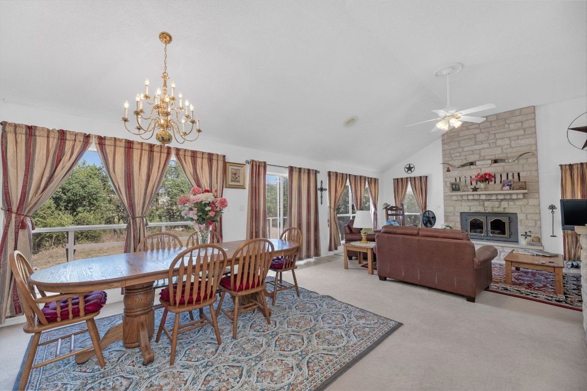 2105 Sam Bass Road Round Rock, TX 78681 - Photo 17 of 40 a living room with furniture and a chandelier