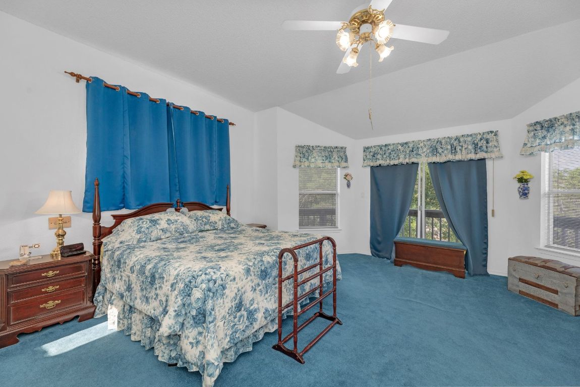 2105 Sam Bass Road Round Rock, TX 78681 - Photo 21 of 40 a bed sitting in a room next to a window