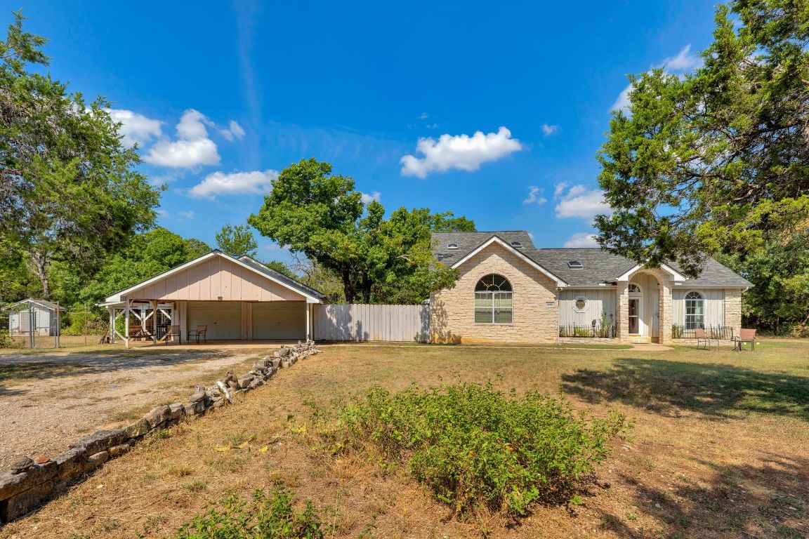 2105 Sam Bass Road Round Rock, TX 78681 - Photo 3 of 40 a front view of a house with a yard and garage