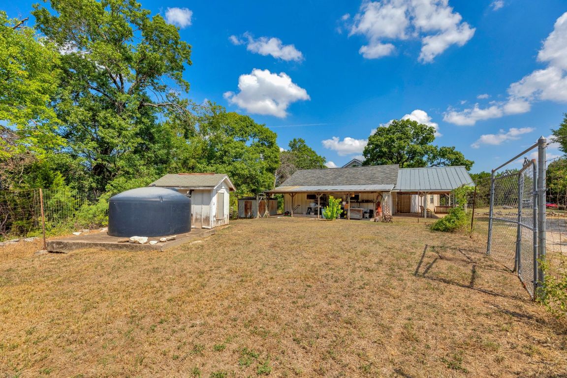 2105 Sam Bass Road Round Rock, TX 78681 - Photo 31 of 40 a front view of a house with a yard and garage