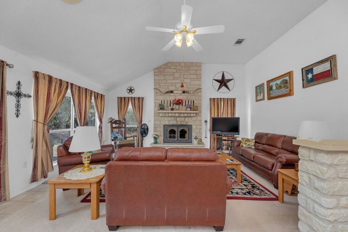 2105 Sam Bass Road Round Rock, TX 78681 - Photo 9 of 40 a living room with furniture fireplace and a window