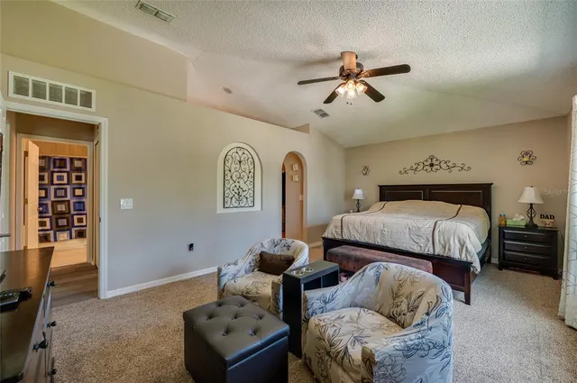 a bedroom with furniture and window