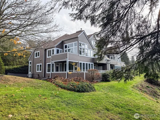 a aerial view of a house next to a yard