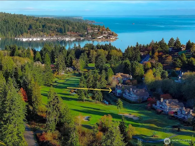 a living room with furniture a fireplace and a large window