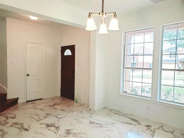 a view of a chandelier in a room with a chandelier and closet