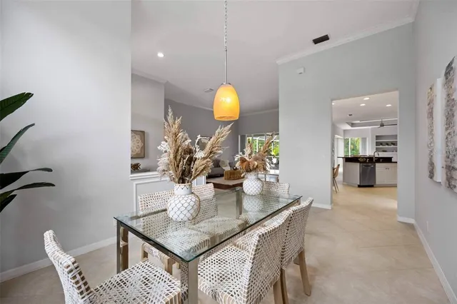 a living room with furniture a flat screen tv and a large window