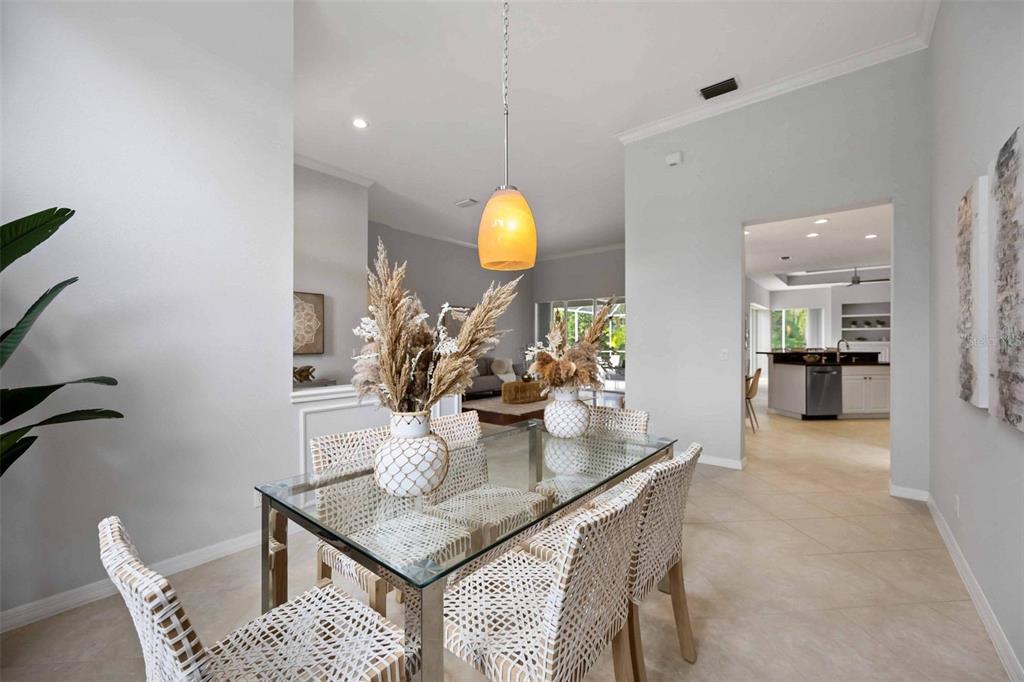 8204 Waterview Boulevard Lakewood Ranch, FL 34202 - Photo 13 of 77 a dining room with furniture and window