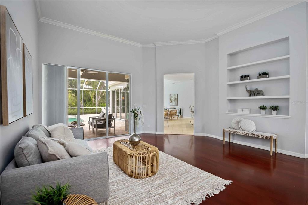 8204 Waterview Boulevard Lakewood Ranch, FL 34202 - Photo 15 of 77 a living room with furniture and a book shelf