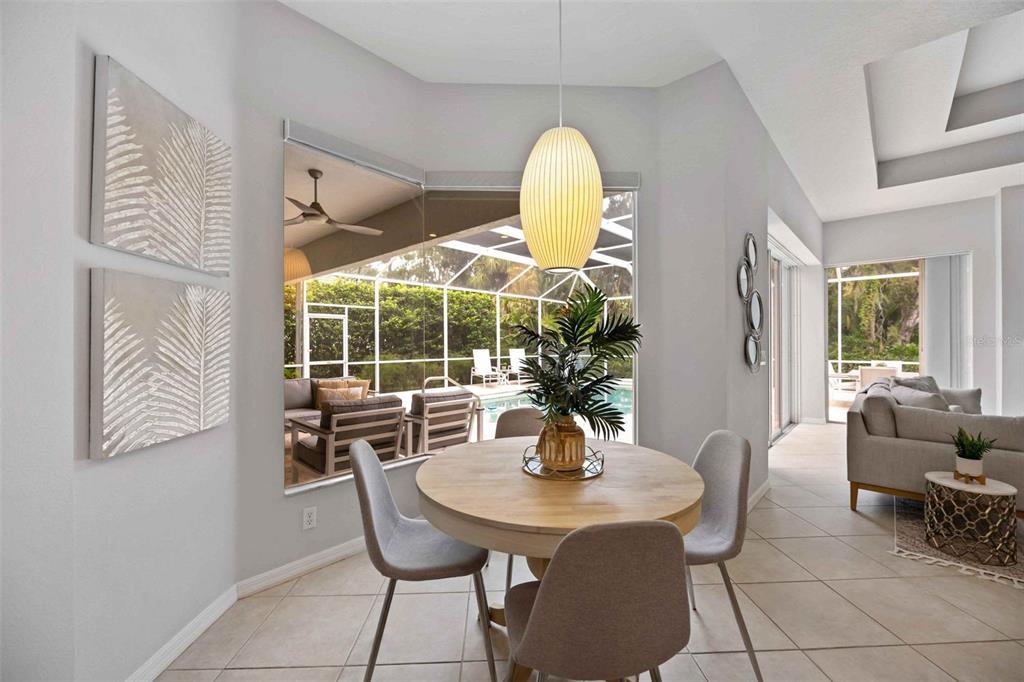 8204 Waterview Boulevard Lakewood Ranch, FL 34202 - Photo 18 of 77 a view of a dining room with furniture window and outside view
