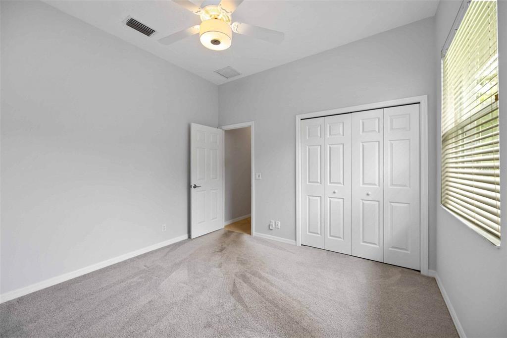 8204 Waterview Boulevard Lakewood Ranch, FL 34202 - Photo 30 of 77 an empty room with windows and closet