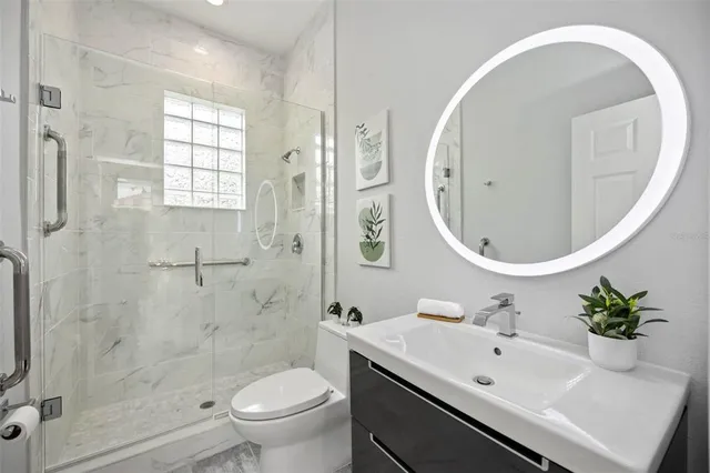 a view of a patio with table and chairs under an umbrella