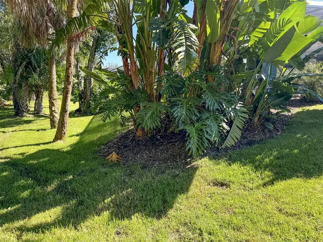 a view of house with swimming pool yard and outdoor seating