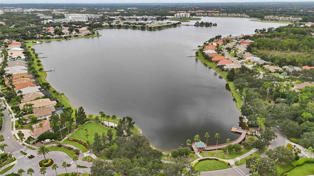8204 Waterview Boulevard Lakewood Ranch, FL 34202 - Photo 62 of 77 an aerial view of lake residential house with outdoor space and trees around