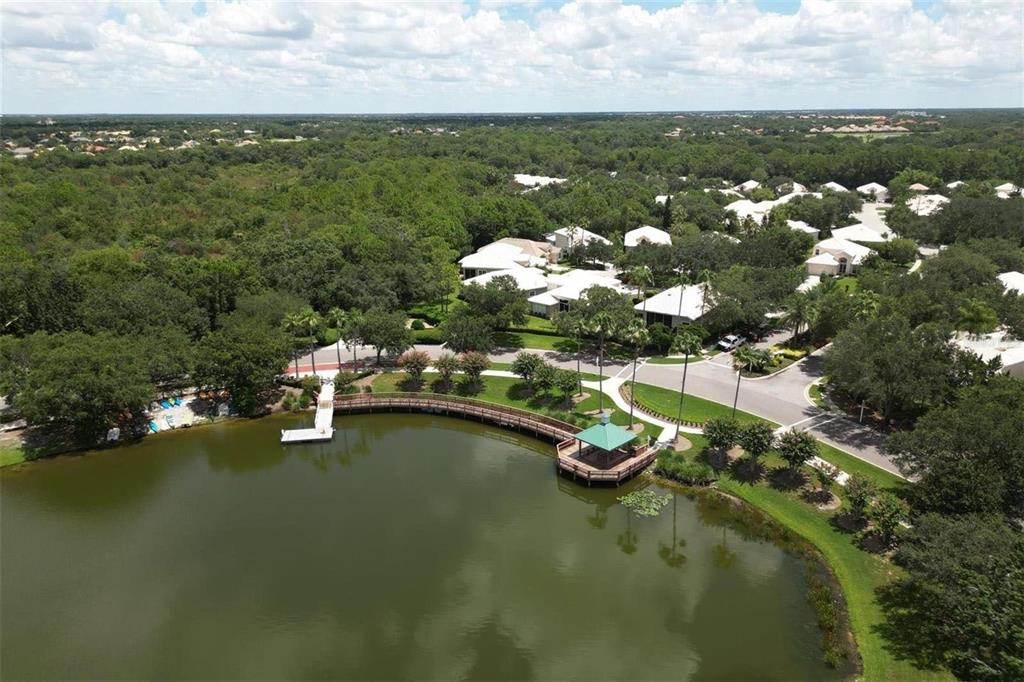 8204 Waterview Boulevard Lakewood Ranch, FL 34202 - Photo 65 of 77 an aerial view of a city with lots of residential buildings ocean and mountain view in back