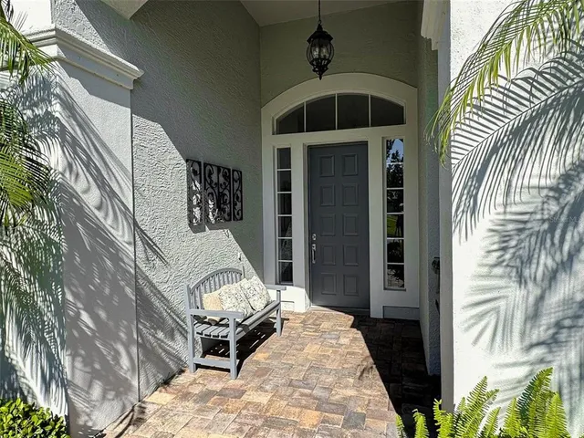 a living room with furniture and a book shelf