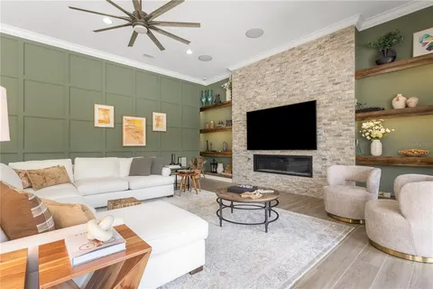 a kitchen with stainless steel appliances granite countertop a refrigerator a sink and a stove